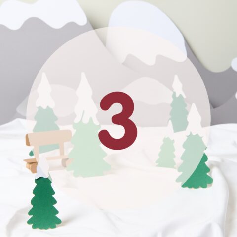 number three in red in a winter landscape