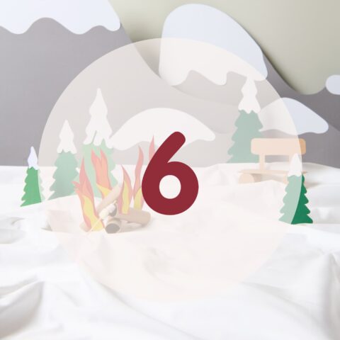number six in red in a winter landscape