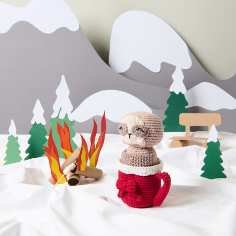christmas cal crochet figure in a winter landscape